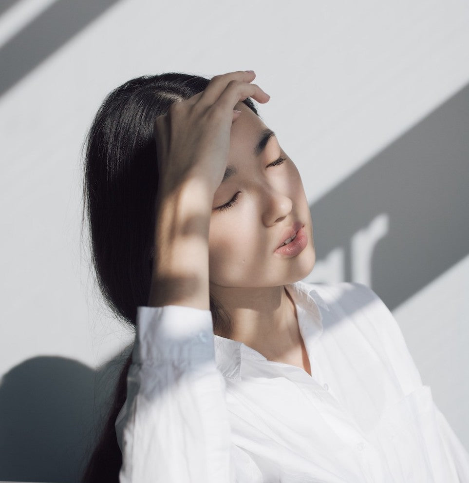 Young girl with clear skin and sunlight on face